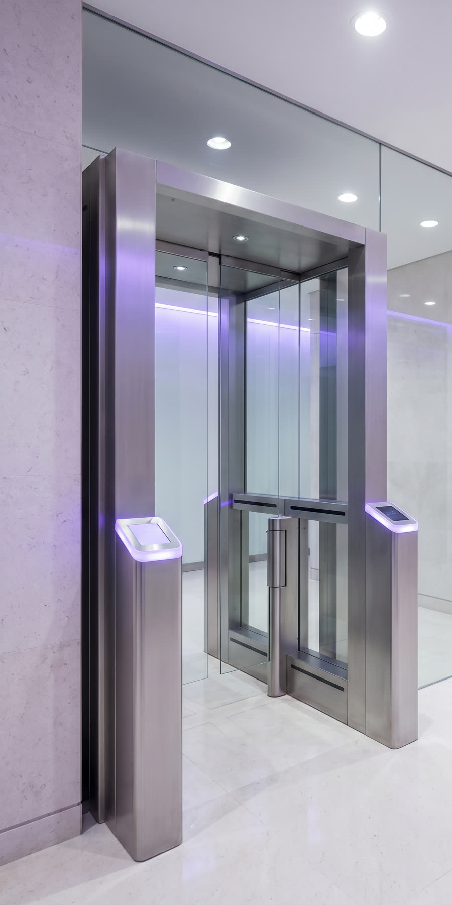 A brushed-steel security portal with violet accent lighting.