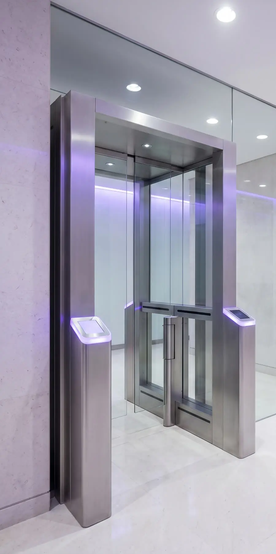 A brushed-steel security portal with violet accent lighting.